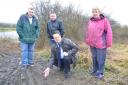 L-R Geoffrey Balden-Smith, Mark Giles, Mike Wood MP and Sue Greenaway show the tracks left by off-road motorcycles at Fens Pool Nature Reserve