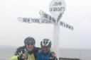 Charity cyclists Richard Westwood and Phil Compson at the end of their 875 mile challenge in John O'Groats.