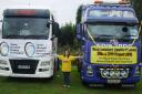 Liver transplant recipient Rachel Day, with the two leading trucks from the charity convoy.