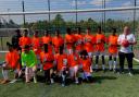 The Benson Community team in their tangerine Sir Stanley Matthews shirts