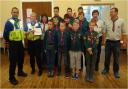 Castle and Priory PCSO’s Omar Sharif and Faye Cartwright handing their donation of £1,500 to members of the 1st Upper Gornal Scout Group.