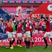Morecambe's Samuel Lavelle (centre) celebrates with the trophy after the Sky Bet League Two playoff final match held at Wembley Stadium, London. Picture date: Monday May 31, 2021. PA Photo. See PA story SOCCER League Two. Photo credit should read: