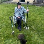Ronald Kindred, aged 94, trying his hand at metal detecting