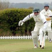 Chris Tranter (69) avoids a run out attempt during Saturday's game
