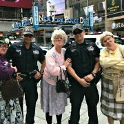 The Dancing Grannies meet the NYPD in Times Square.