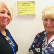 Dudley Group chief executive Diane Wake with Linda Taylor from the children's ward unveiling the plaque in memory of Steve Ford