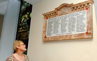 Liz Cope,from Savoy family history group surveys a memorial to Netherton war heroes at St Andrews Church, Netherton. 261406LA