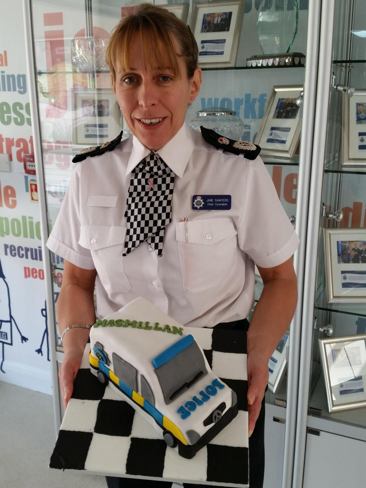 Staffordshire Police's Chief Constable Jane Sawyers with the police car cake the force has raffled off in aid of Macmillan's Coffee Morning appeal. The raffle raised £122.
