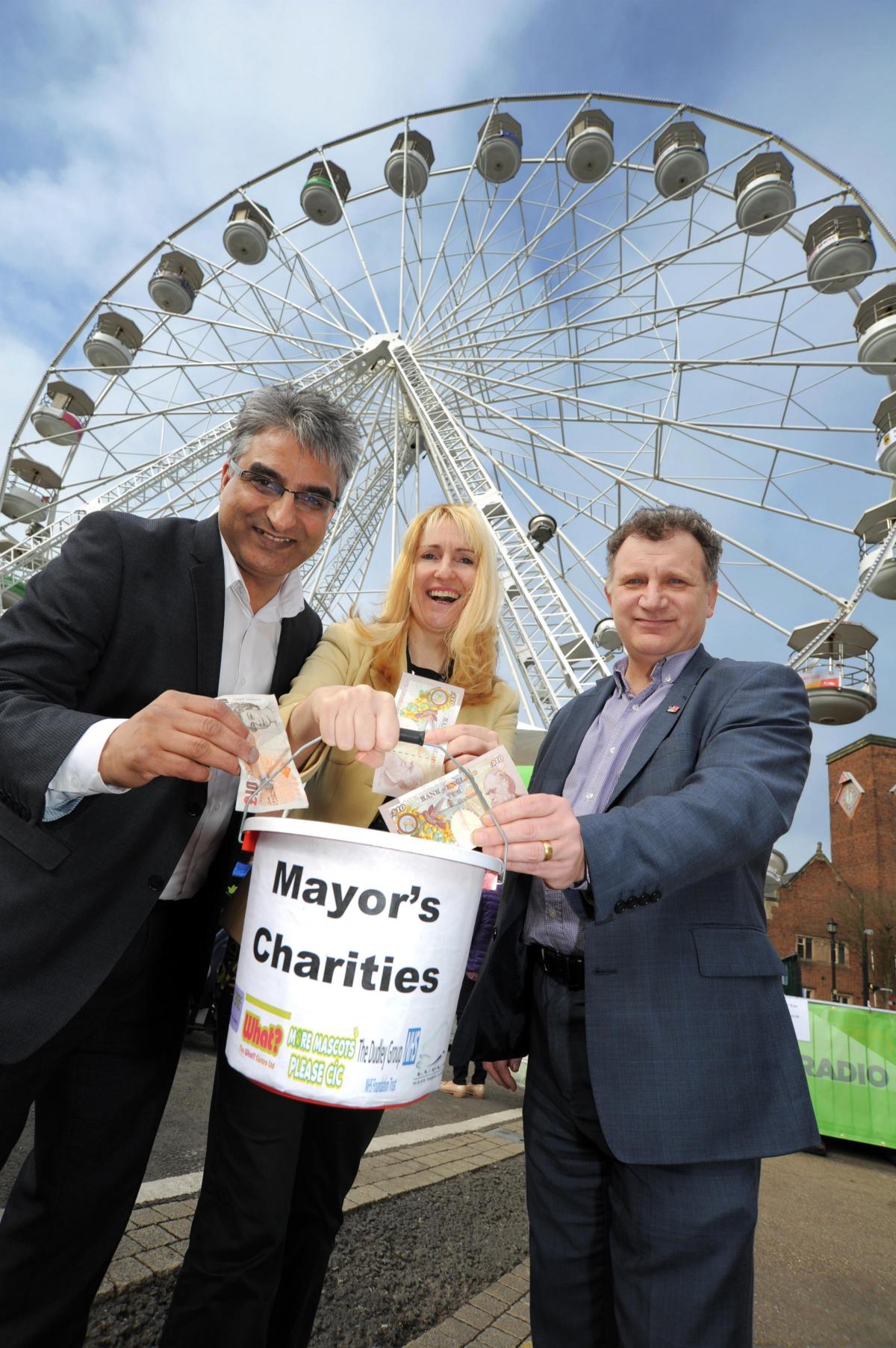 Cllrs Khurshid Ahmed, Judy Foster and Pete Lowe collect money for the Mayor's charities
