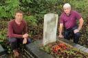 Quarry Bank and Dudley Wood Labour councillor Chris Barnett and Labour candidate Brian Roe inspect one of the Commonwealth War Graves in the overgrown Victoria Road graveyard