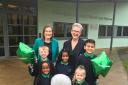 Pictured (left) Joanna Turner, Executive Headteacher and (right) Sally Bloomer, Headteacher,  celebrating with pupils from Woodside Primary School