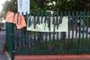 A poignant farewell as ties are hung on the school railings.