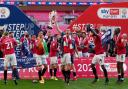 Morecambe's Samuel Lavelle (centre) celebrates with the trophy after the Sky Bet League Two playoff final match held at Wembley Stadium, London. Picture date: Monday May 31, 2021. PA Photo. See PA story SOCCER League Two. Photo credit should read: