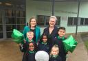 Pictured (left) Joanna Turner, Executive Headteacher and (right) Sally Bloomer, Headteacher,  celebrating with pupils from Woodside Primary School