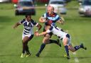 DK's Simon Fletcher is tackled during Saturday's derby loss
