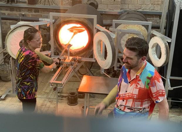 Dudley News: Glass artist Allister Malcolm, right, at work in the hot glass studio