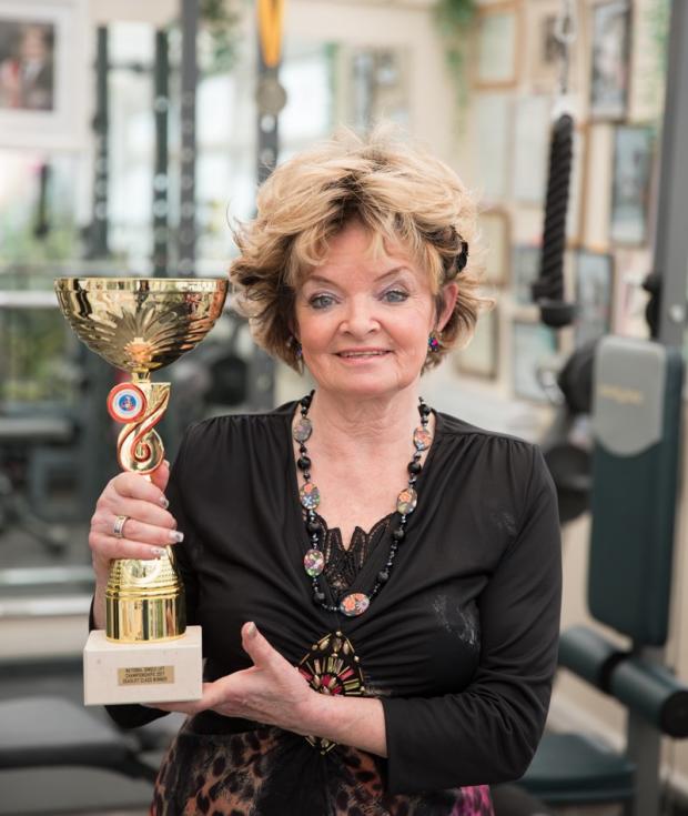 Dudley News: Pat Reeves pictured with her trophy in her home gym