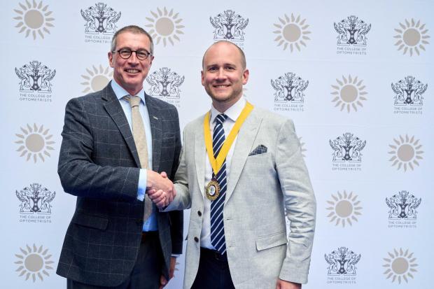 L-r - Past president Colin Davidson congratulates Professor Leon Davies, from Hagley, on his appointment as the new president of the College of Optometrists