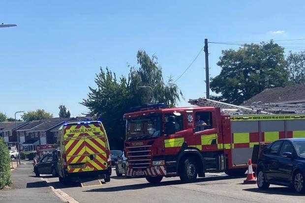 EMERGENCY: An ambulance and a fire engine at the scene of the crash in Winchcombe Drive, off Blackpole Road, Worcester where the car flipped over