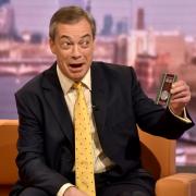 Nigel Farage holding up the 50p Brexit coin  on The Andrew Marr Show in 2020. Image/PA.