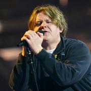 Lewis Capaldi joked about his battle with impostor syndrome whilst on Hot Ones