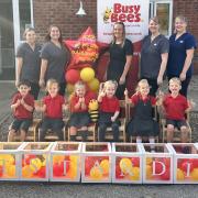 Staff and children at the nursery celebrate its Outstanding Ofsted rating