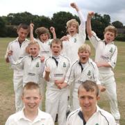om Hayward (vice captain) and Ryan Farnsworth (captain) and the rest of the under-13s team celebrate