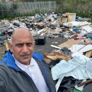 Cllr Shaukat Ali at the scene of the fly-tipping near the Cavendish House site in Dudley.