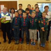 Castle and Priory PCSO’s Omar Sharif and Faye Cartwright handing their donation of £1,500 to members of the 1st Upper Gornal Scout Group.