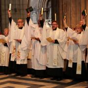 New Black Country priests Alex French, Chris Enwerem and Sue Hale, with their fellow candidates during their ordination at Worcester Cathedral. Photo: Worcester Diocese