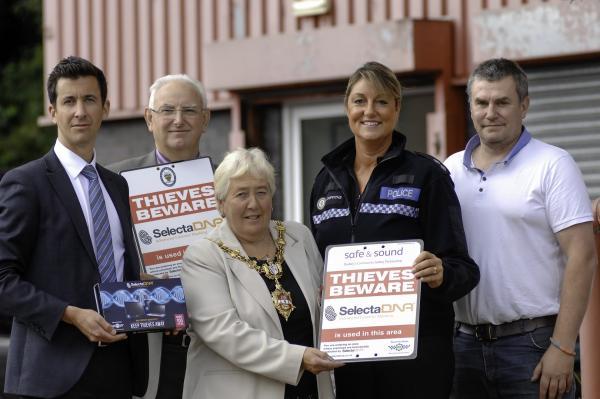 Members of safe & sound donate a property marking kit to Dudley business Orson Equipment. L to r: James Brown, of SelectaDNA, Bob Dimmock, safe & sound, mayor of Dudley Cllr Margaret Aston, acting inspector Corinna Griffiths & Dave Wood, Orson Equipment